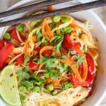 Veggie stir fry with noodles on a white plate