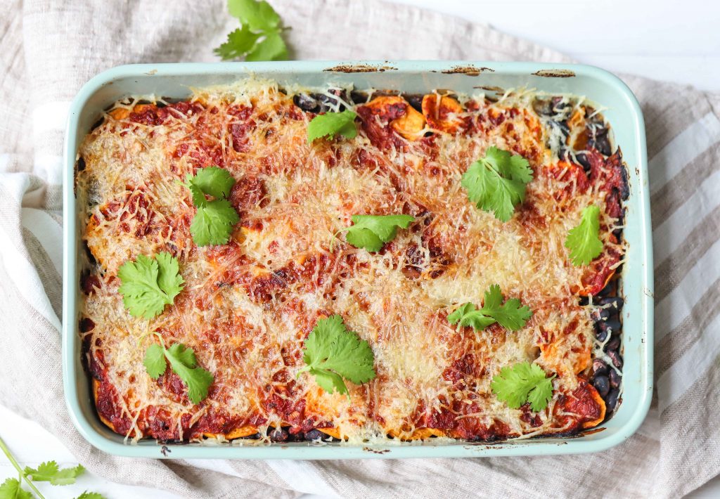 Sweet potato and black bean casserole in a white dish