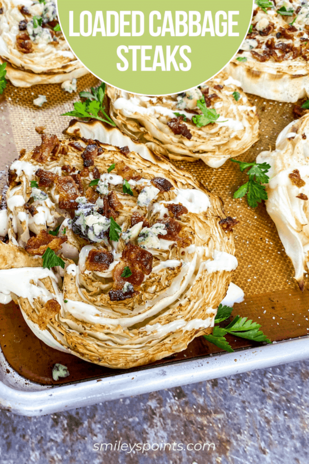 loaded cabbage steaks with bacon on cookie sheet