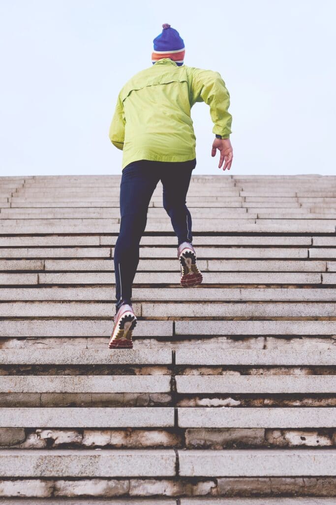 person running up the stairs. Being physically active