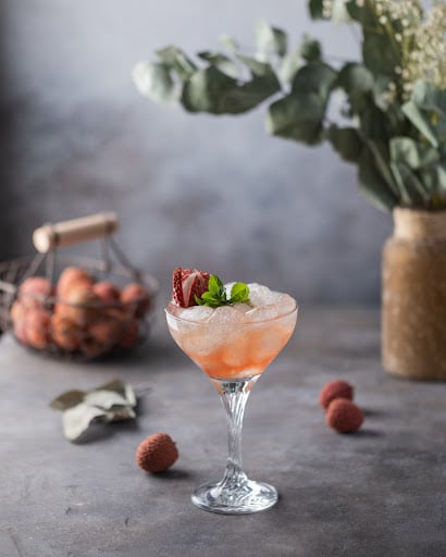 lychee cocktail with ice is on the table